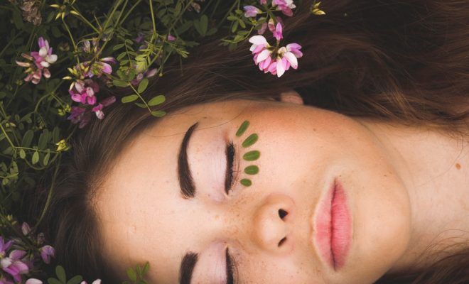 woman sleeping with pink flowers